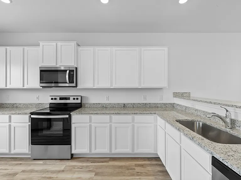 Chef-ready kitchen with granite countertops.