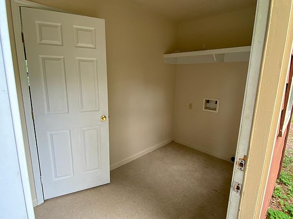 Alternate view of front entry into laundry / mud room. Washer and electric dryer hookups here.
