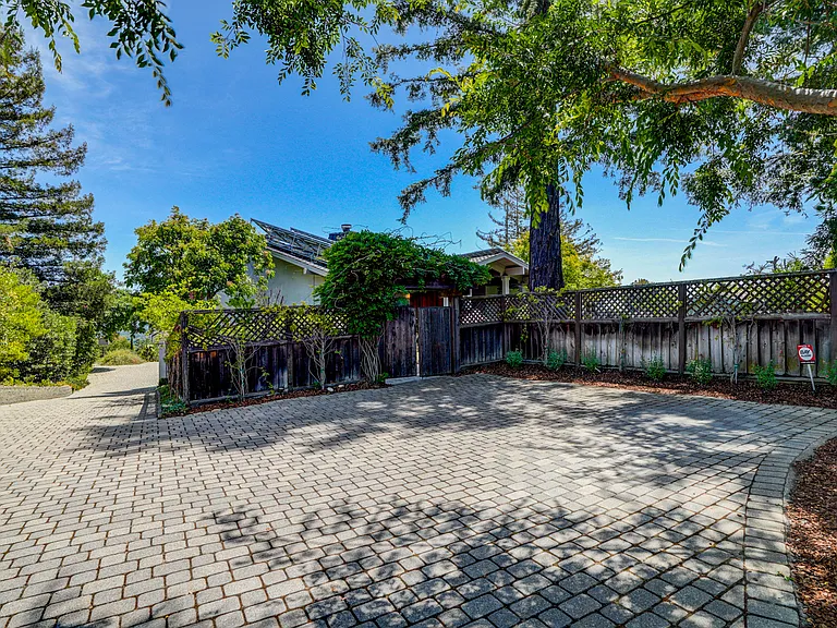 This tranquil home is located at the end of a cul-de-sac featuring a sparkling pool at the front and a wonderful rear upper deck beckoning for entertainment or relaxation, offering a spectacular view of the bay.