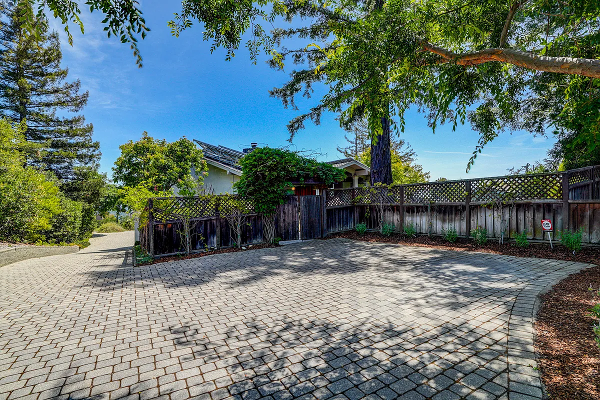 This tranquil home is located at the end of a cul-de-sac featuring a sparkling pool at the front and a wonderful rear upper deck beckoning for entertainment or relaxation, offering a spectacular view of the bay. - 12580 La Cresta Dr