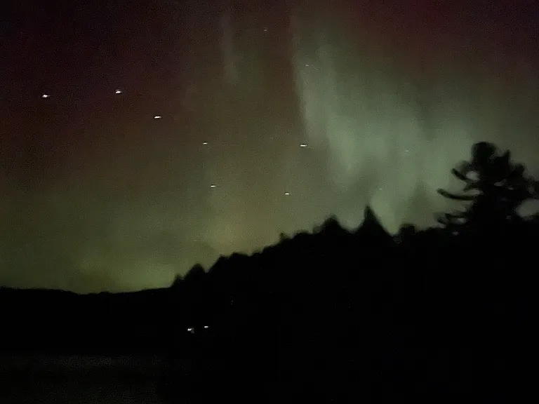 View the night sky and northern lights from your dock. Photo taken by 2025 renter. Lake front property rental Upper Peninsula #VacationRental