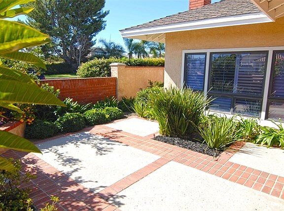 Very private professionally landscaped front entry Courtyard