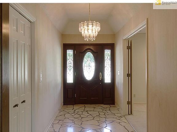 Large Entry w/ Chandelier and Marble Floor