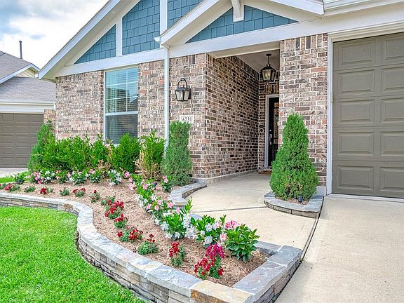 This home sits on a large lot with ample yard space in front and the back, lush landscaping and well-maintained yard with pool and spa!