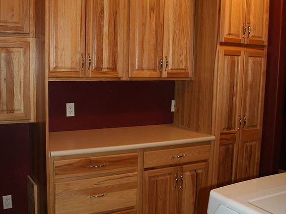 laundry with custom cabinets