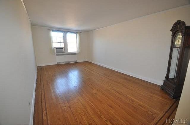 Large living room with covered hardwood floors. Room is 21' x 1