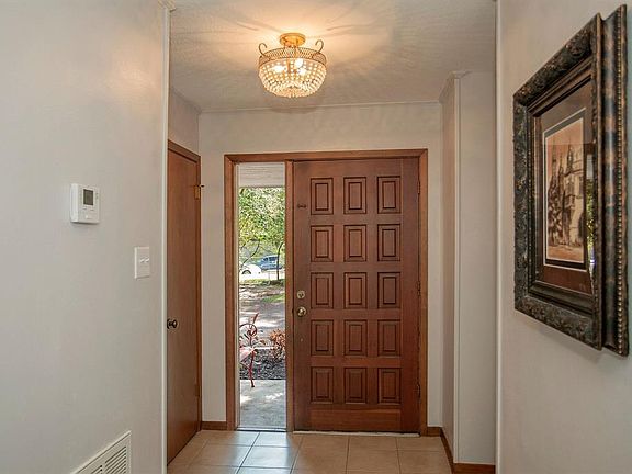 Evident from the moment past the wood door and side glass window of the filed foyer is understated elegance.