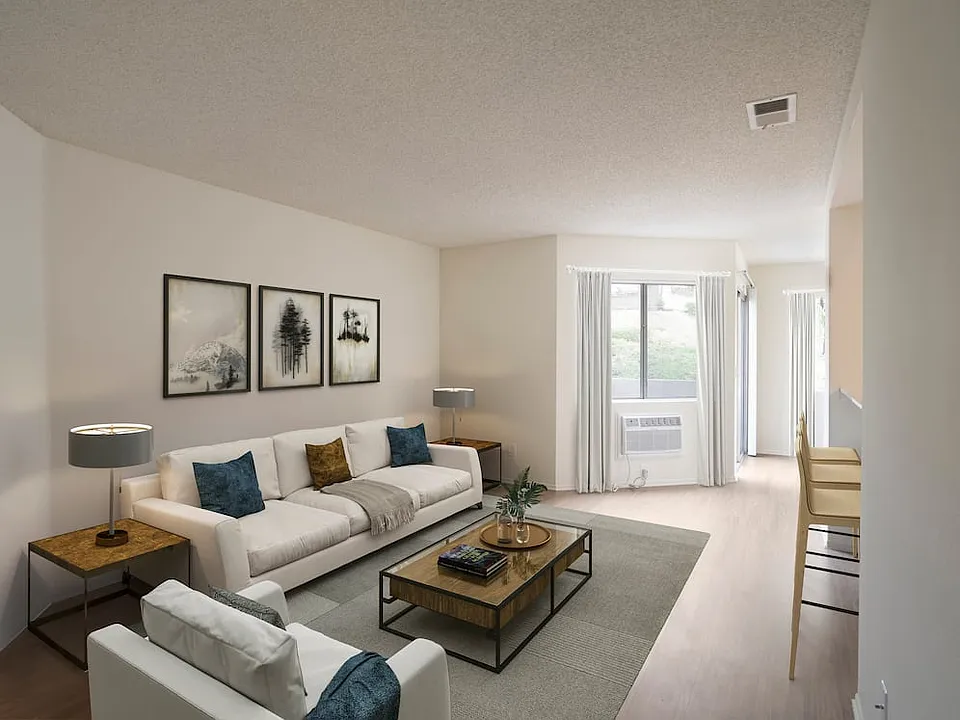 Renovated Package I living room with hard surface flooring