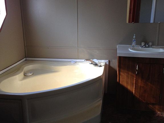 Master bath has garden tub and separate shower, has his and