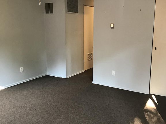 A view of the living room from the front corner by big windo