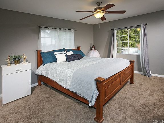 Spacious master suite with designer lighted ceilin