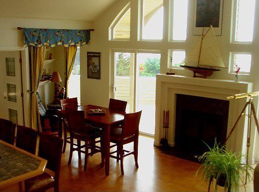 Inviting great room with fireplace and access to large deck.