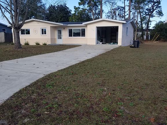 Freshly painted with added outside patio in back.