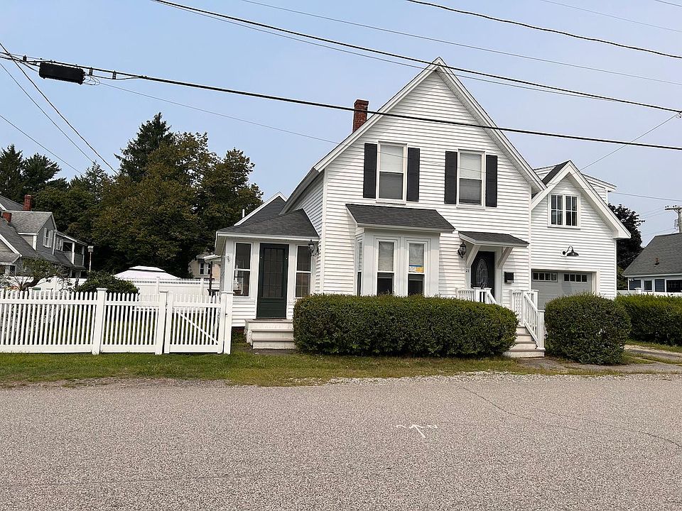 Full house and fenced side yard, view from the street
