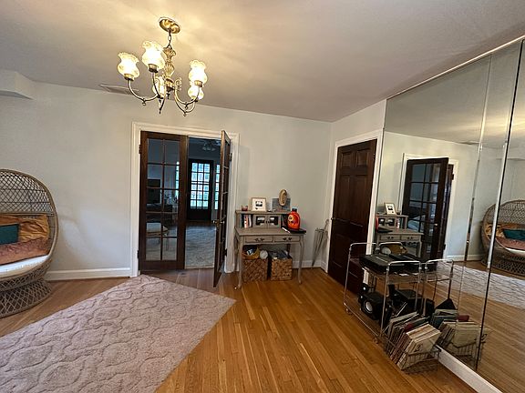 The door to the right of the French doors conceals a huge closet.
The mirrors have been removed.