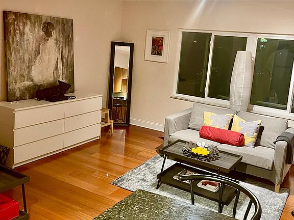The sleek living room at nighttime.