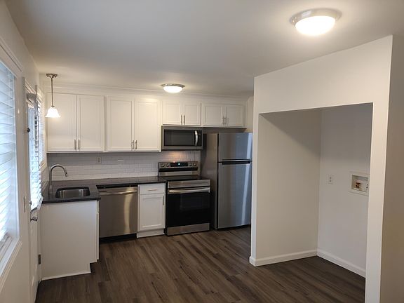 Eat-in kitchen with laundry area and separate storage closet