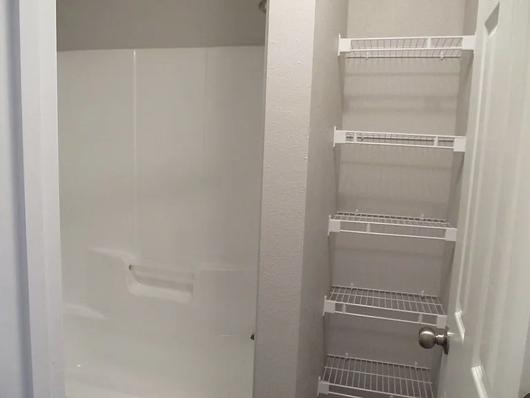 Master Bathroom Linen Closet and Tub