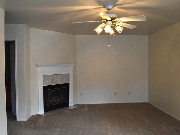 Living Room with gas fireplace and fan