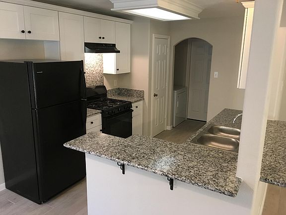 Adorable kitchen, notice the matching granite backsplash above the Stove.