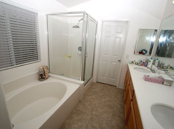 MASTER BATH WITH SOAK IN TUB AND SHOWER. WALK IN CLOSET AT THE END OF THE LINE