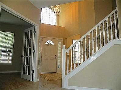 Entry. Nicely appointed staircase and front office.