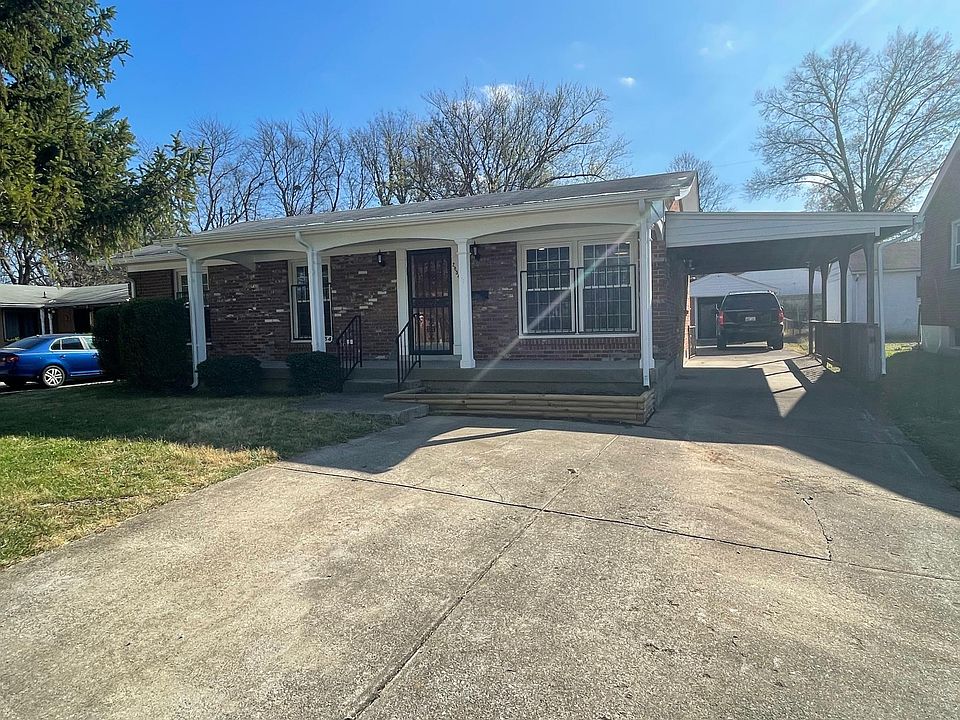 Brick Ranch with large driveway. drive through the carport to your garage