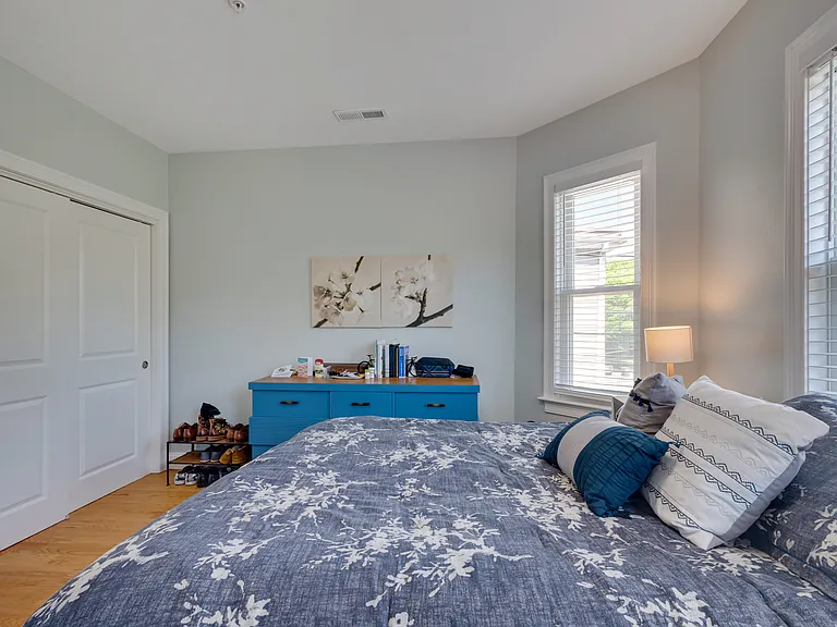 Sliding door closet in large bedroom