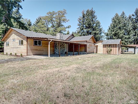 Back of home, well house, covered patio, or another carport!
