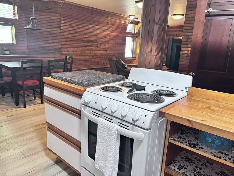 kitchen, includes a stove, refrigerator, and microwave