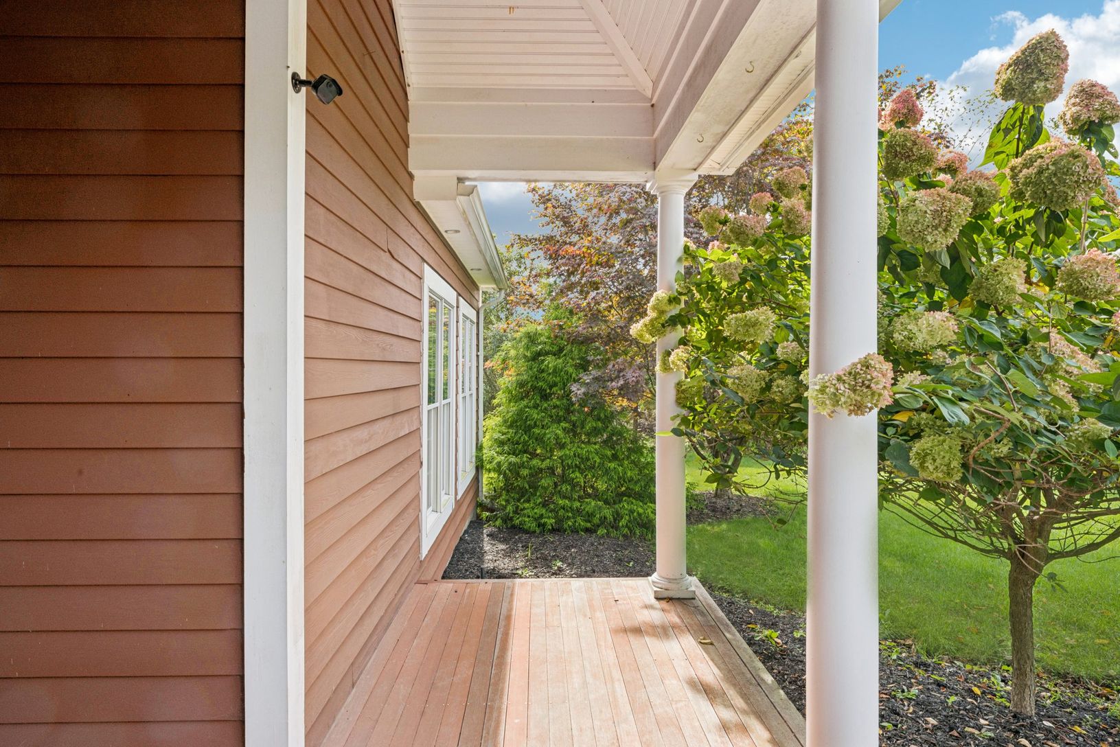 Charming view highlighting the home’s welcoming front porch.