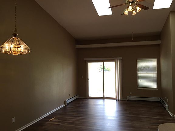 Living room with vaulted ceiling and skylights, view of Gran
