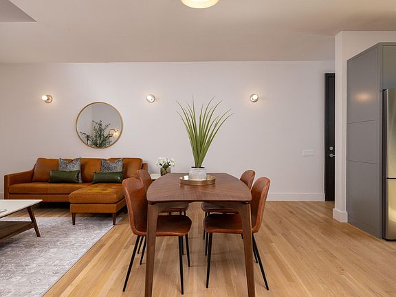 Dining area situated between the living room and kitchen, featuring a table with comfortable seating for 4_perfect for meals and gatherings.