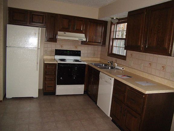 Refrigerator with icemaker, disposal, dishwasher and range i