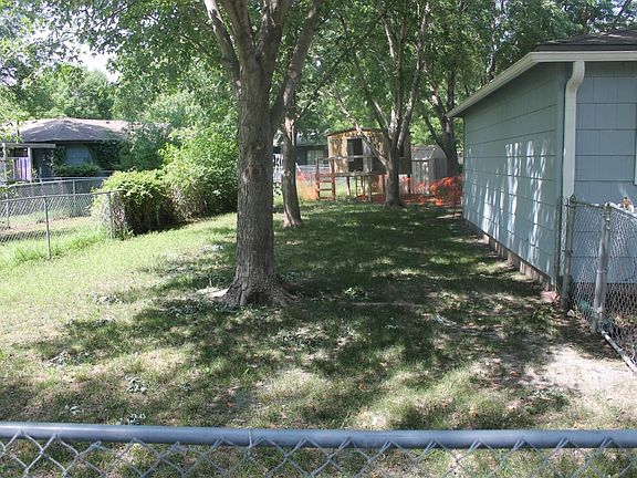 Fenced In Backyward with covered patio