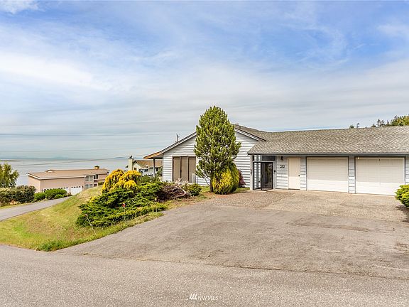 Two car garage with ample space to have a shop or for extra storage space.