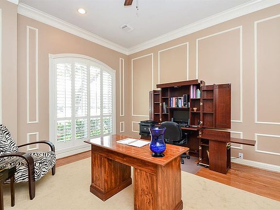 Details like shuttered windows, wainscot, crown molding, wood floors round out the elegance in your private study