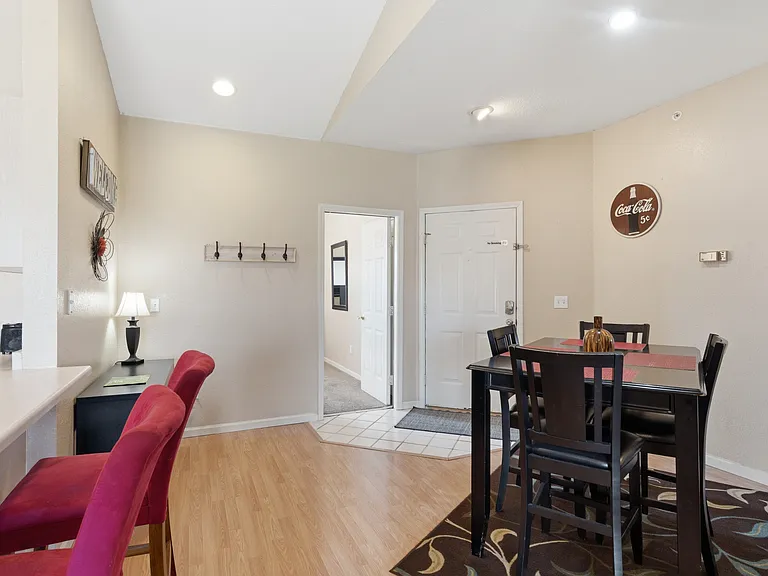 entry way with kitchen bar and dining set