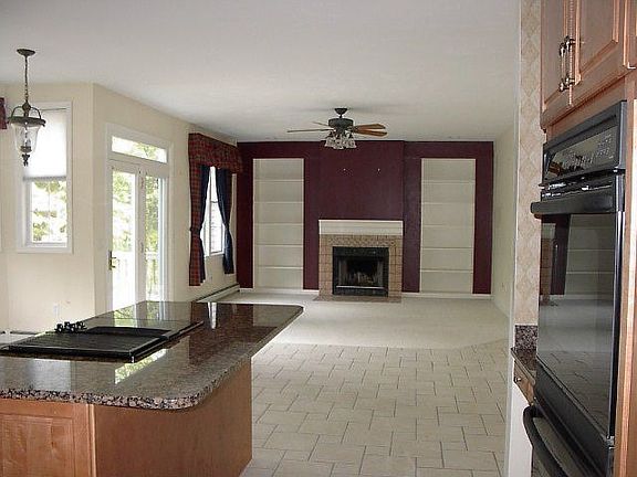 Kitchen open into fireplaced familyroom