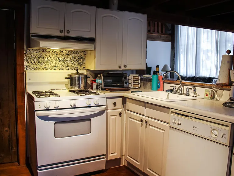 Efficiency kitchen now has new GE electric range and new dishwasher.