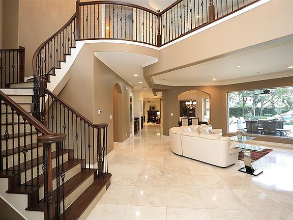 IMPRESSIVE HEART-STOPPING VIEWS AS YOU ENTER THIS HOME - This grand foyer entrance has spectacular wide open views of the pool, spa and expansive back yard! Marble Flooring throughout adds elegance and style, recessed lighting all living areas, and a