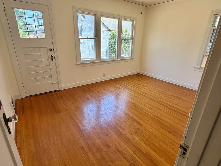 Bedroom one with door to back yard