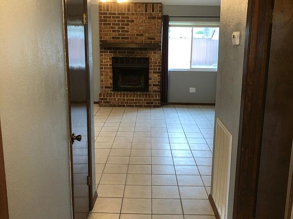 Original den has a wood-burning fireplace.