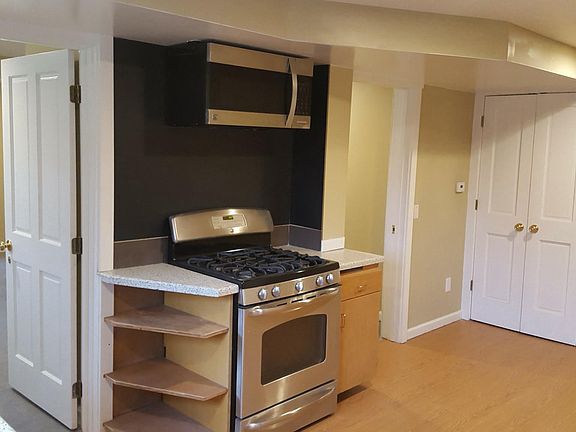 Kitchen with 2 doors to living room