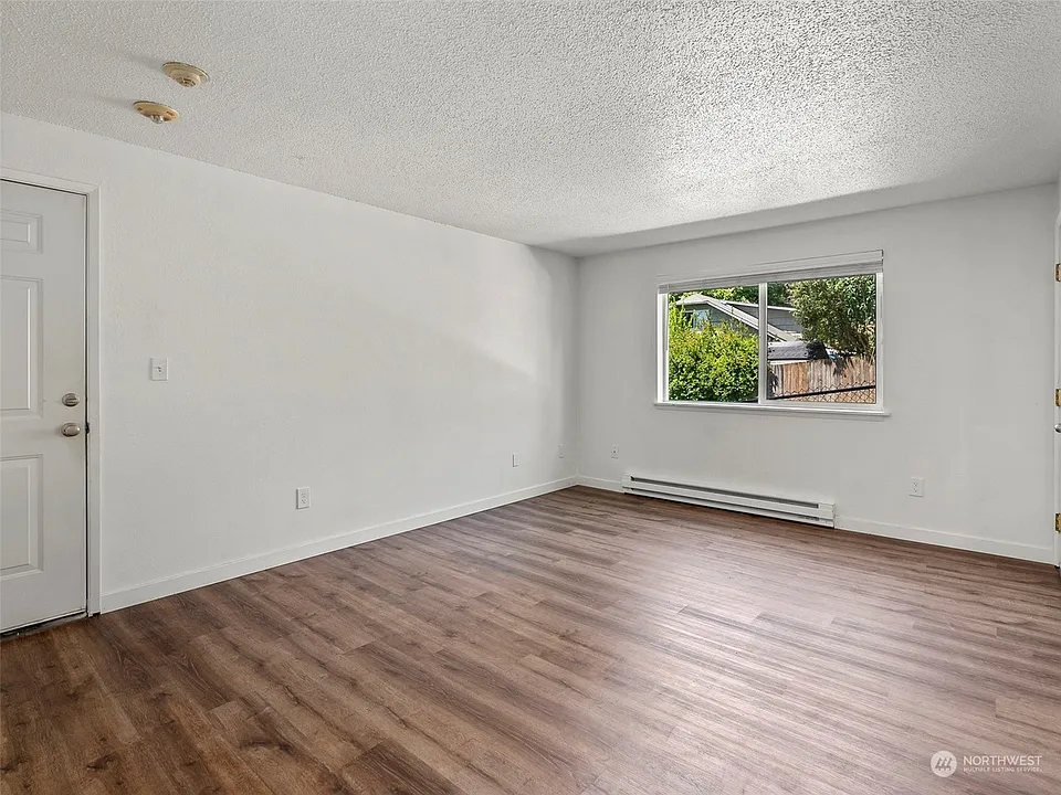 Apt 16 - Spacious Living Room with Gorgeous Wood Plank Flooring