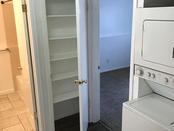 Hallway looking into front bedroom and bathroom