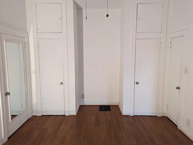 Master bedroom with 12-foot ceilings and two large, double-level closets.