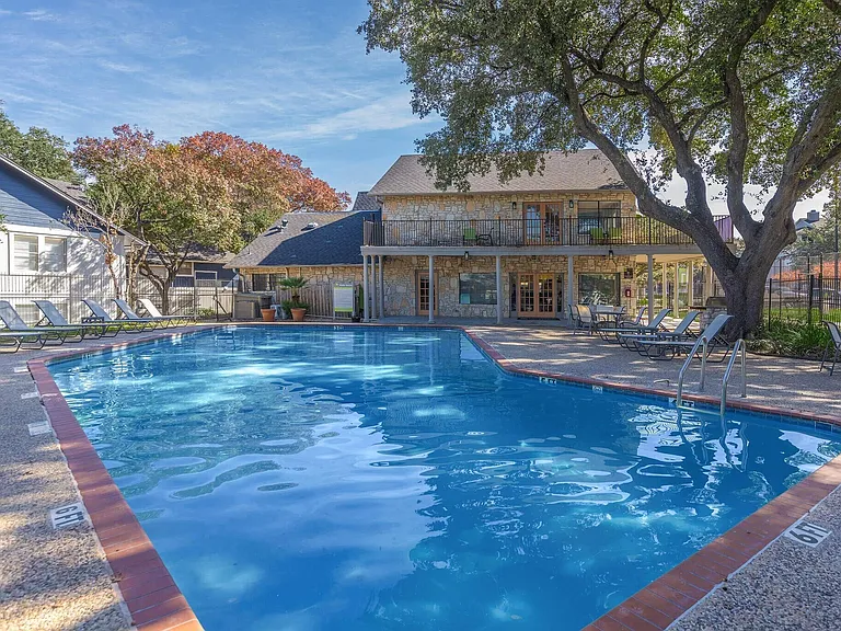 Experience luxury living at Distinction Apartment Homes. Enjoy a stunning pool surrounded by lush landscaping, perfect for relaxation and community gatherings. Elevate your lifestyle in a vibrant, welcoming environment. Schedule your tour today!