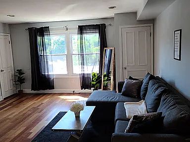 Great sunlight and beautiful cherry hardwood floors
