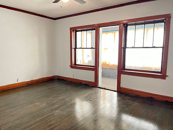 Living room that opens to a front sunroom that is